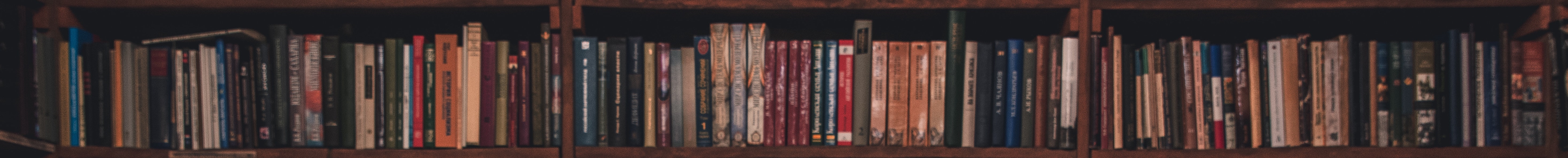 A bookcase full of random books.